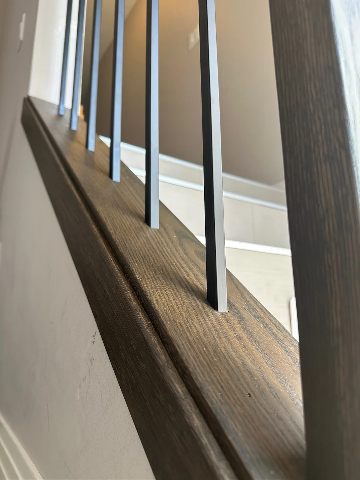 Custom staircase and railing built by Ben's Carpentry in the Edmonton area